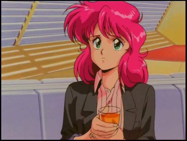 Nene, a pale-skinned, pink-haired woman with green eyes, wears a light pink button-down shirt and gray blazer. She has a look of concern on her face while she drinks orange liquid. She is sitting on a white couch in front of a window with long, Roman-style blinds. This image is drawn in a 1980s anime style.